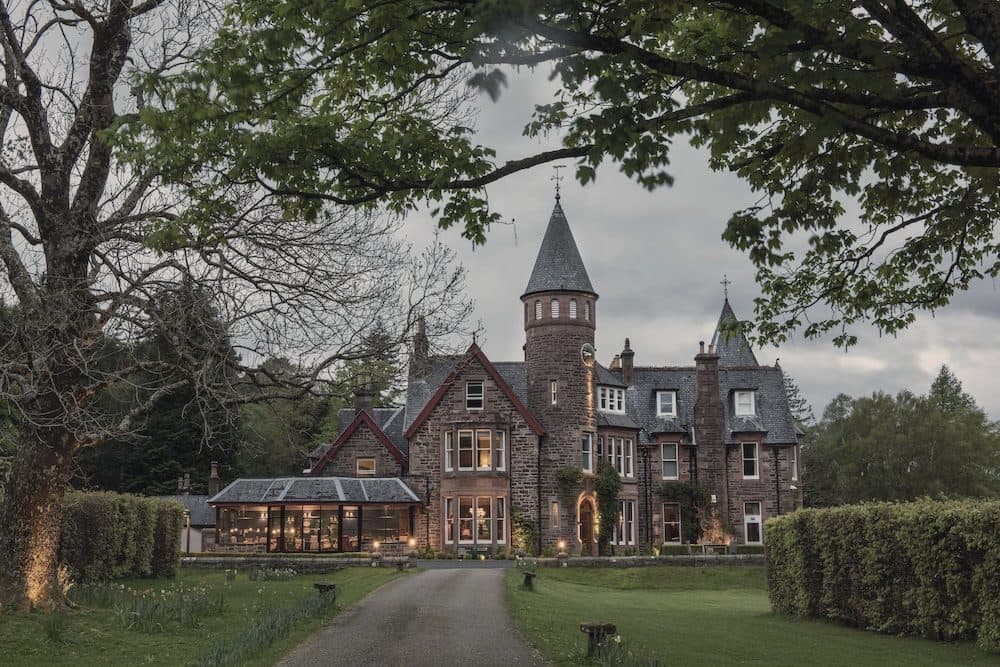 The Torridon at dusk, a Victorian shooting lodge on the loch, Wester Ross
