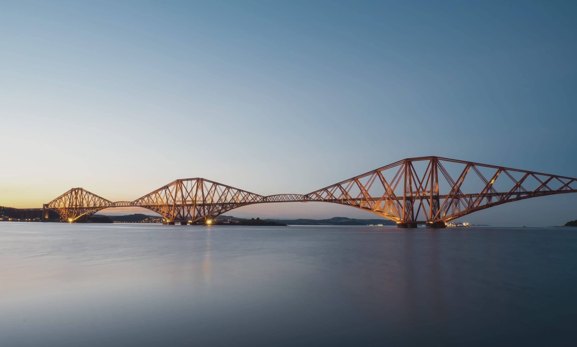 The Forth Bridge at dusk, the railway crossing the firth north of Edinburgh