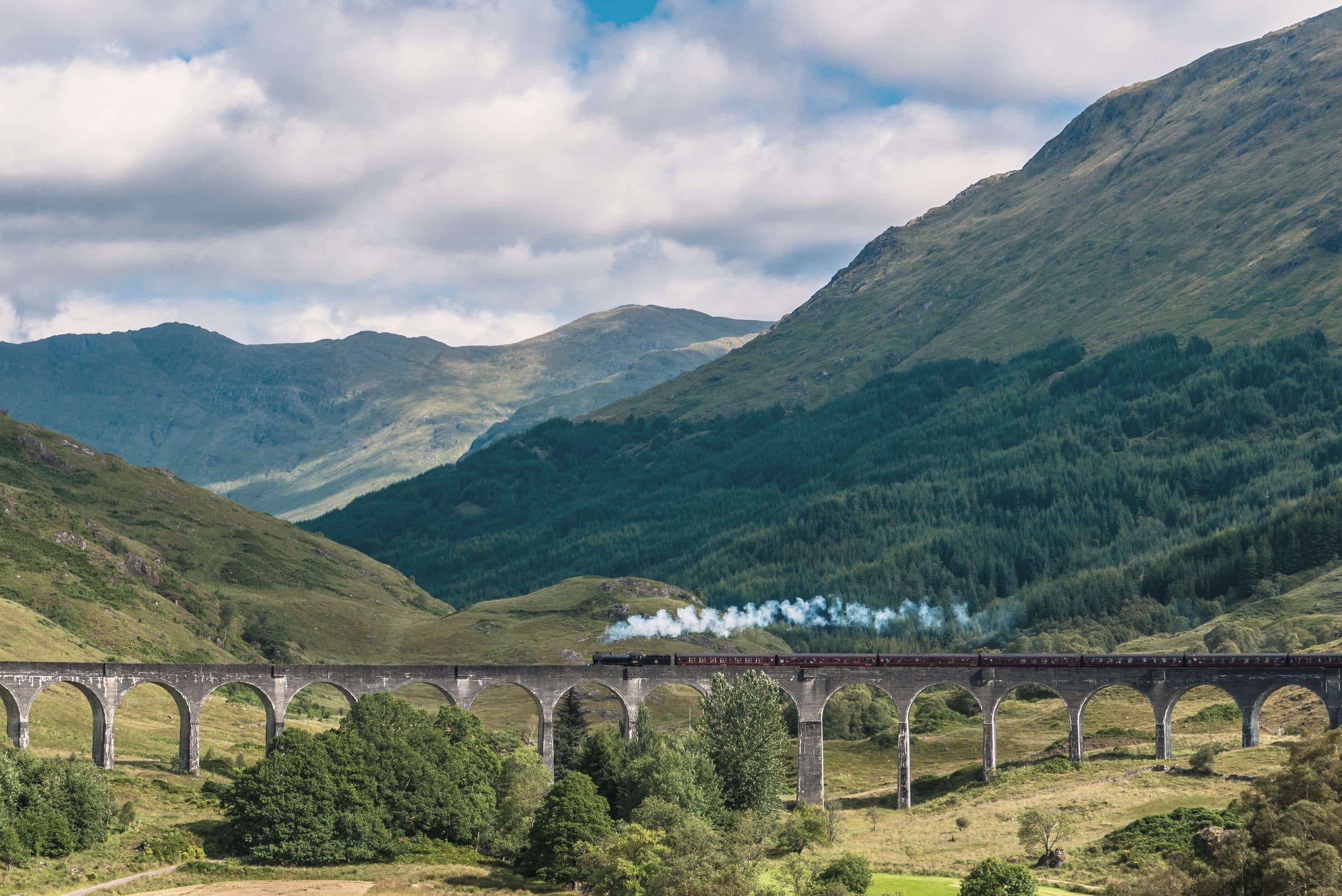 The Glenfinnan Viaduct seen across the glen, the West Highland Line